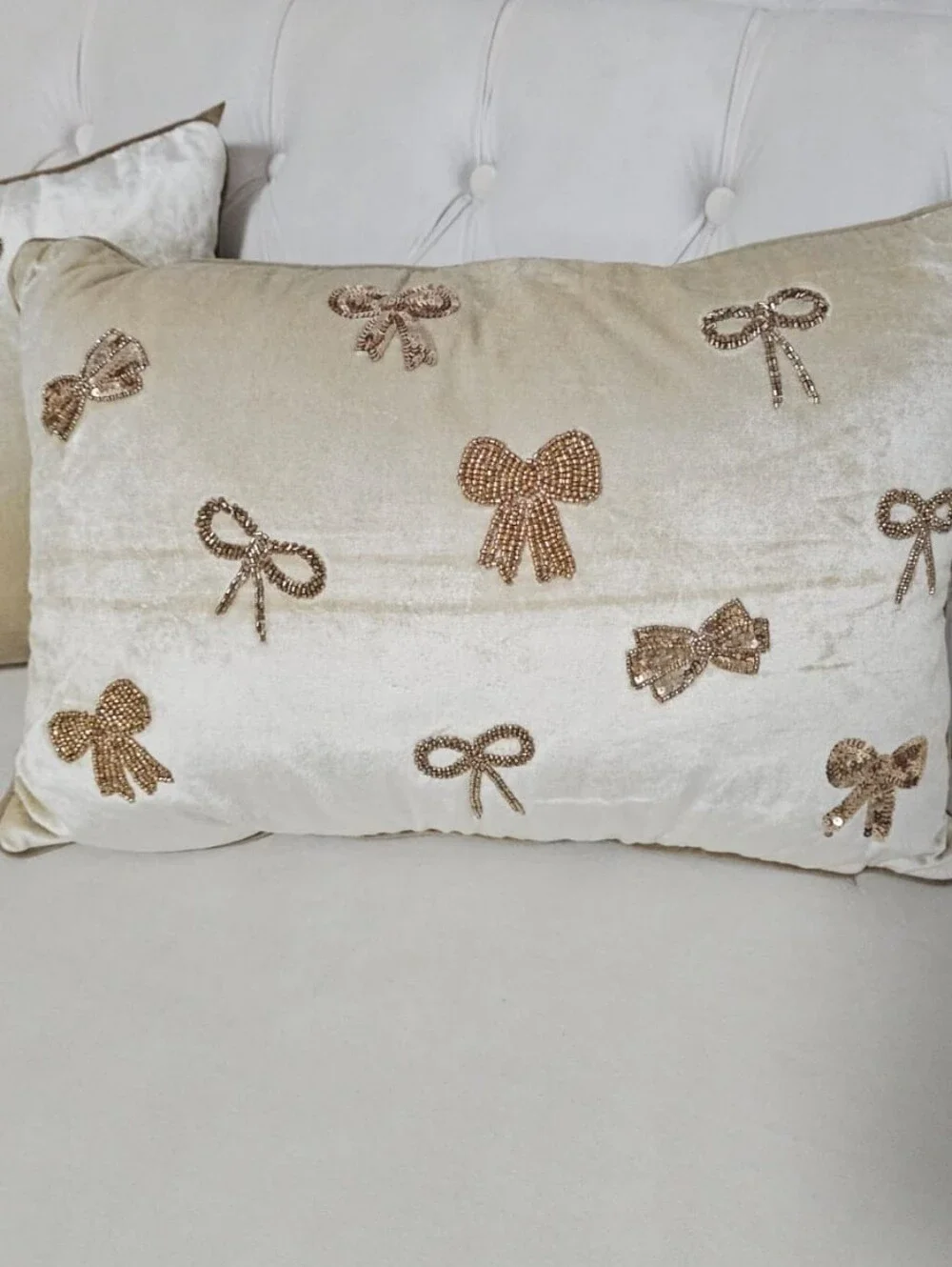 Elegant Cream Velvet Throw Pillow with Gold Sequin Bows